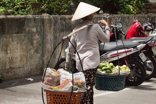 Woman with Fruit Baskets